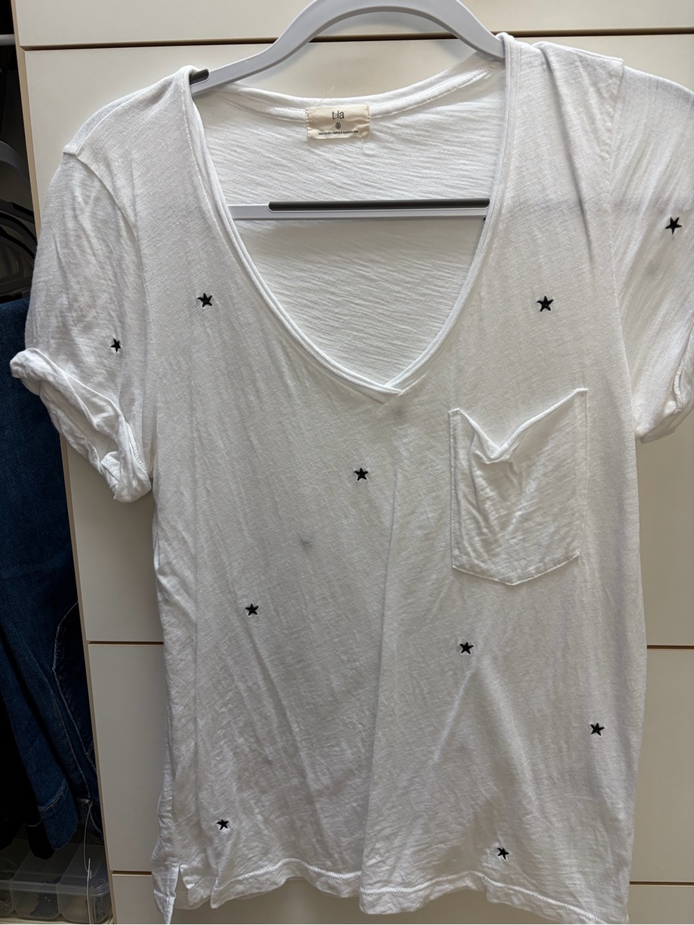 T.La White V-Neck Pocket Tee with Black Star Accents
